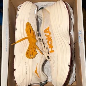 Hoka Cream Running Shoes with Mustard Yellow Laces and Burgundy Outsoles